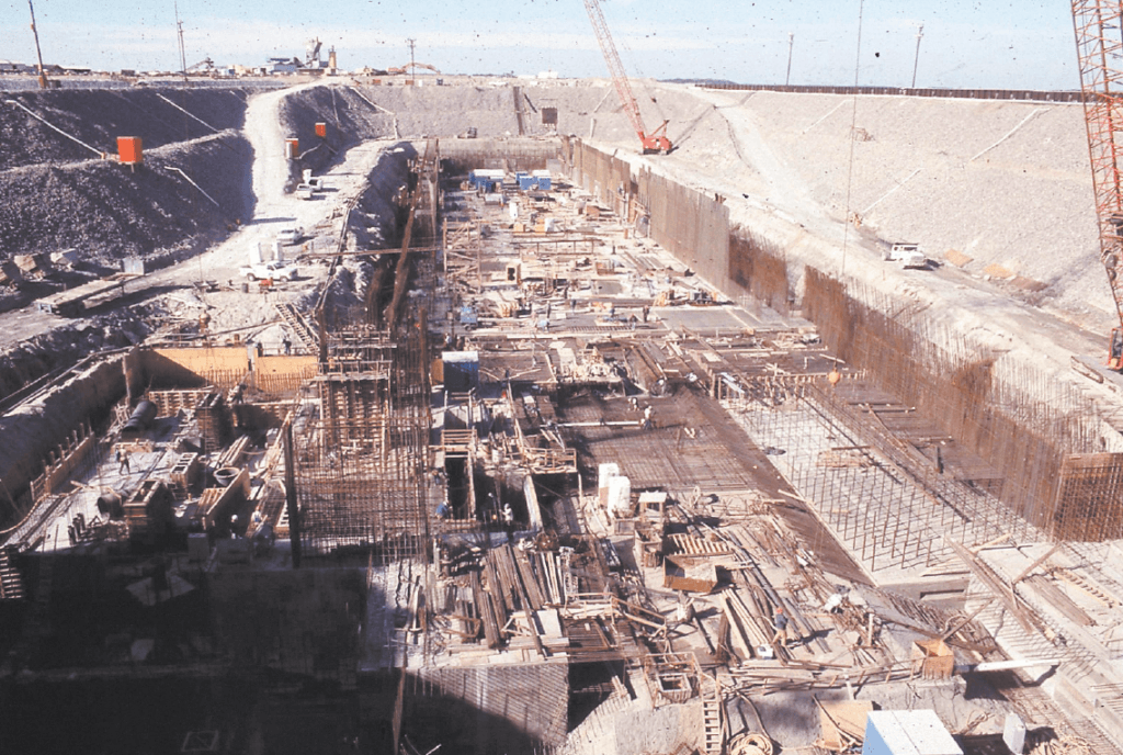 This photograph shows a massive pit filled with supplies for the construction of the dry dock in January of 1988.