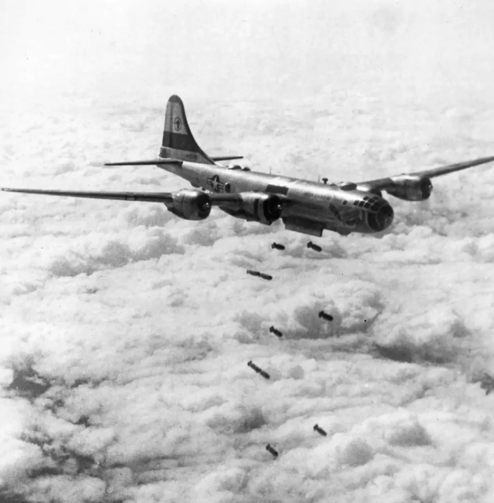 A B-29 "Superfort" of the 19th Bomb Group unloading heavy tonnages of bombs somewhere in Korea. August 1951