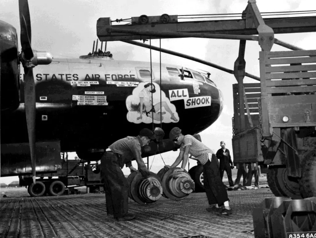 korean war b-29 being loaded high explosive bombs from truck