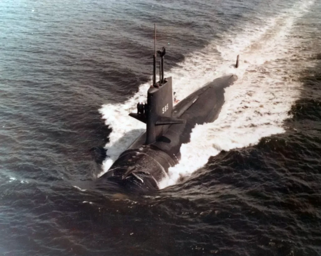 The nuclear-powered attack submarine USS Skipjack (SSN-585) sails on the surface.