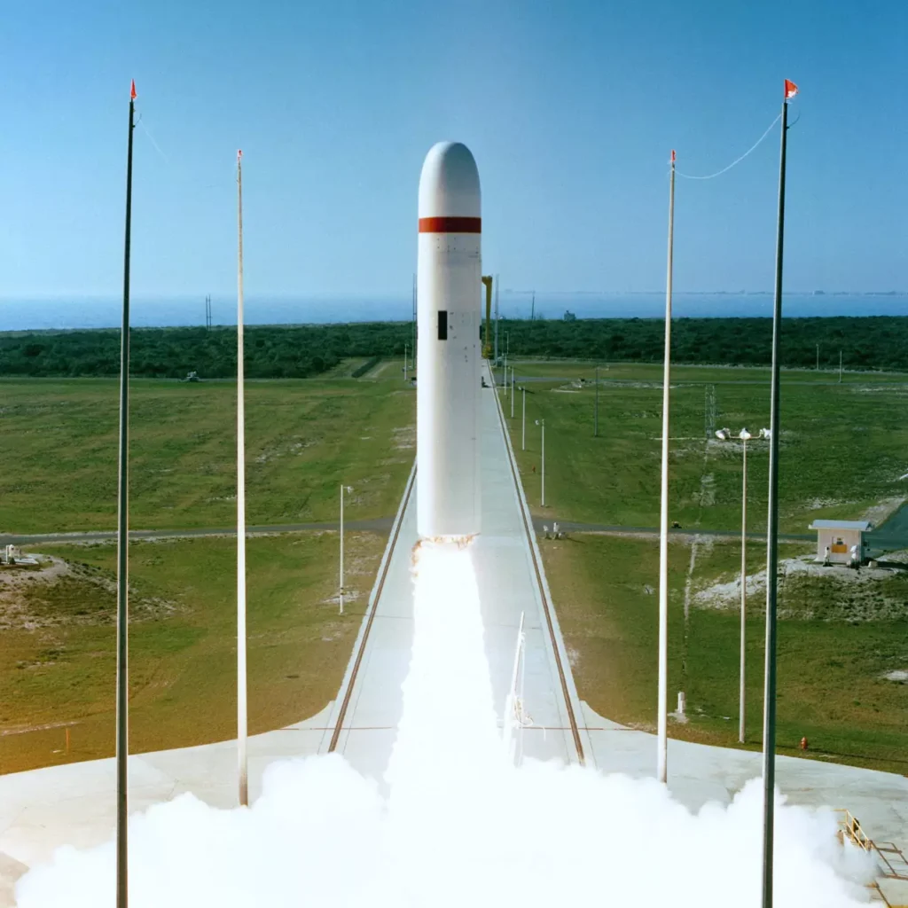 The initial developmental flight test model of the Trident II D5X-1 missile is fired from a flat launch pad on 15 January 1987