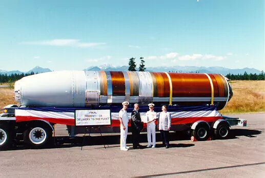 U.S. Navy officials receiving the final Trident C-4 delivery to the fleet.