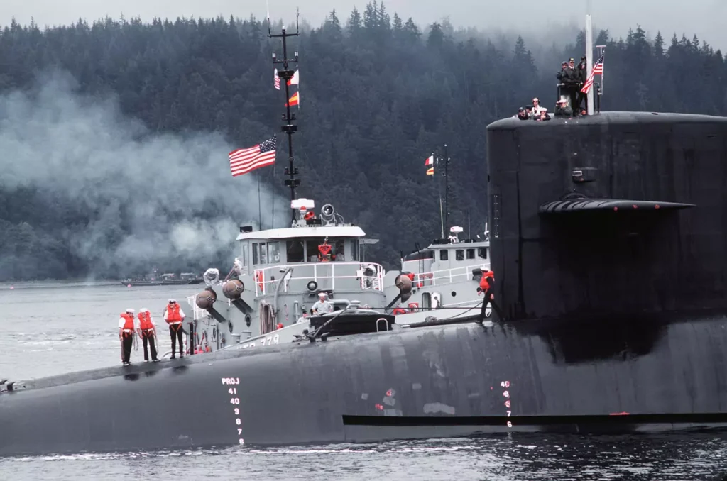 uss-ohio ssbn-726 forward beam-view-together with large harbor tugs