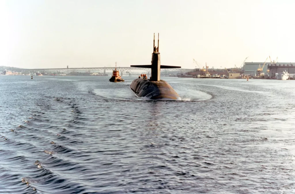 Aerial bow view of USS MICHIGAN (SSBN-727) leaving port