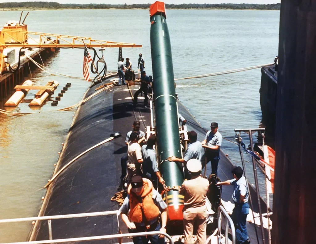 A Mark 48 torpedo being loaded aboard an attack submarine.