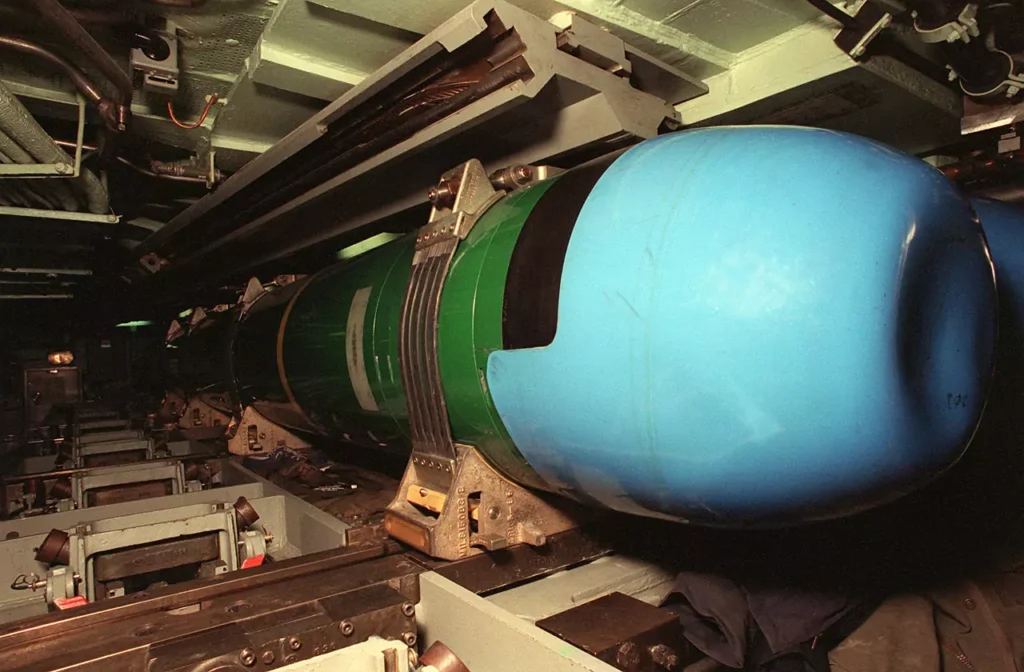 A Mark 48 ADCAP (advanced capacity) torpedo in a storage rack in the torpedo room of the USS ASHEVILLE (SSN-758)